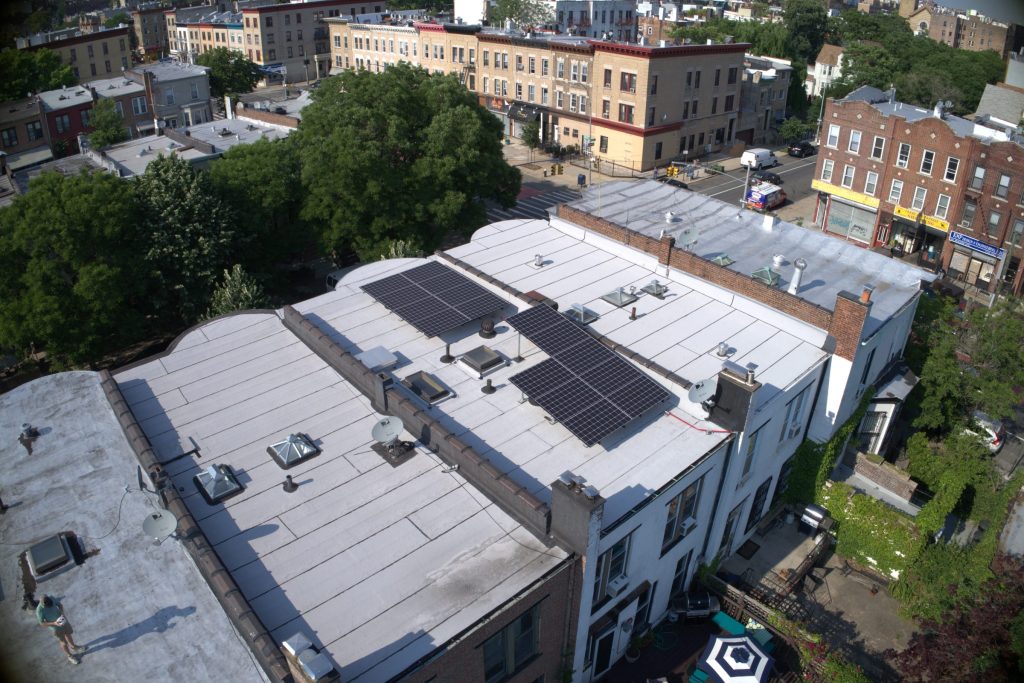 Solar tilt rack system on a historic landmarked brownstone in Brooklyn, New York.