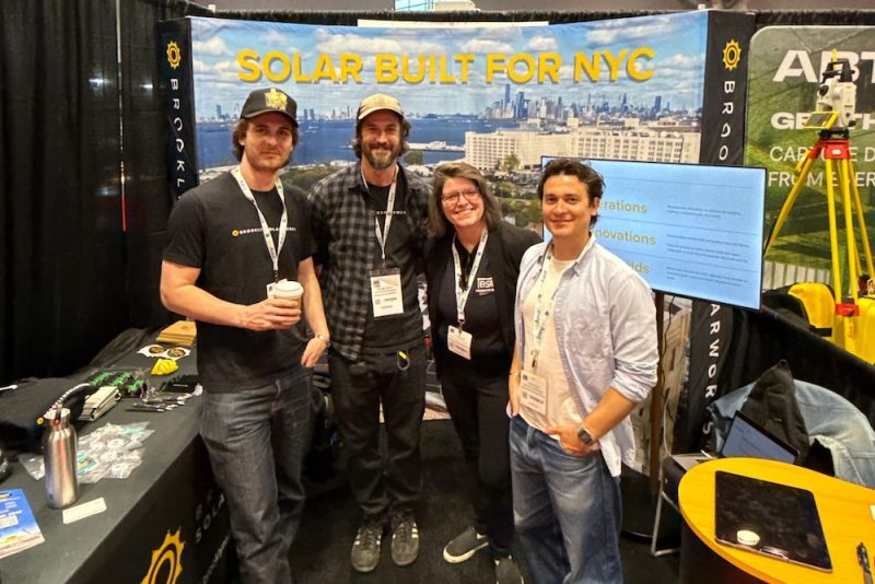 Four Brooklyn SolarWorks team members standing at their booth at the NY Build Expo 2025