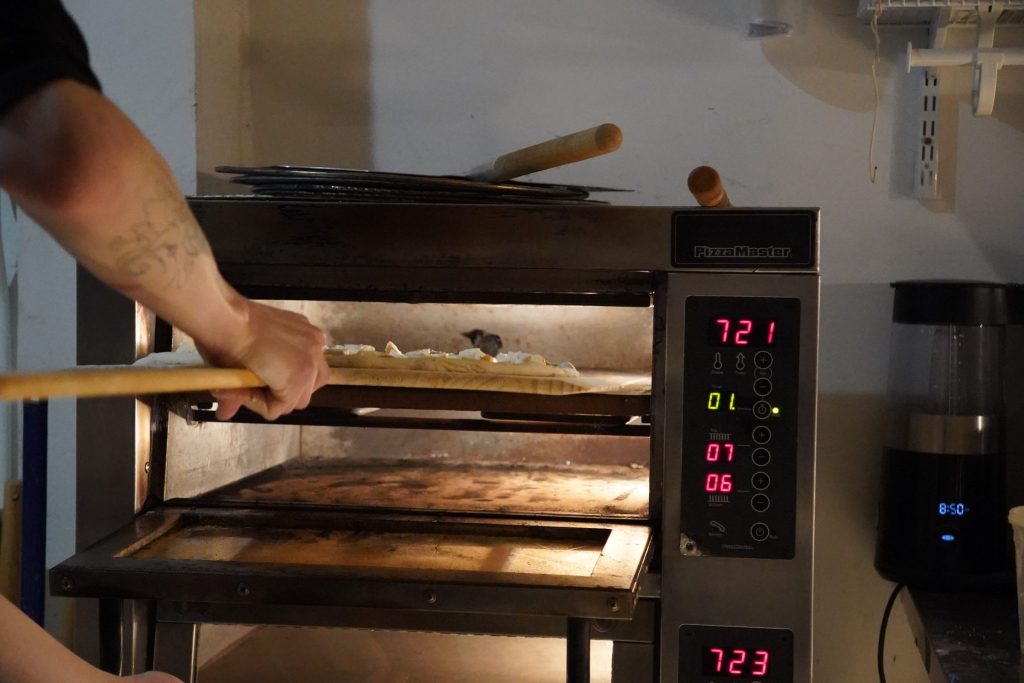 Starrlight Pizza's all electric ovens baking fresh pizzas. Powered by solar.